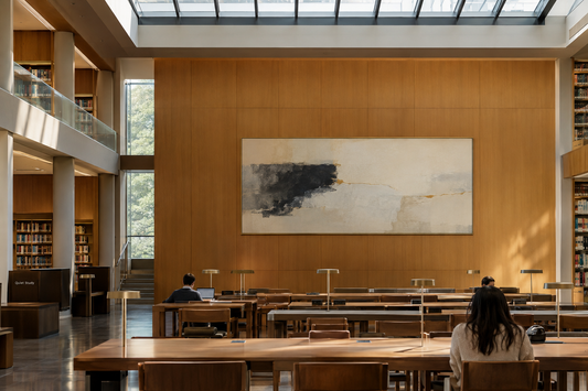 Modern university library reading hall with brushed brass framed oversized abstract canvas wall art