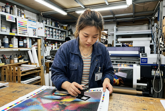 Prepress color technician inspecting giclee canvas ink dot registration with magnifying loupe in factory workshop